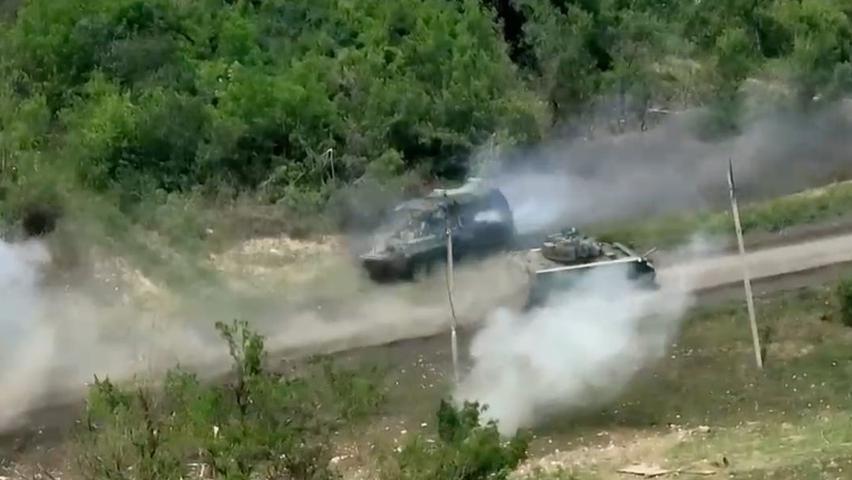 American Tank and Russian Car Fight in Ukraine