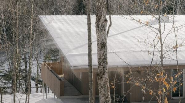 A Stunning Wooden Home in Quebec with a Unique Roof