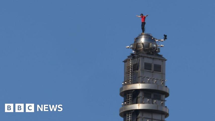Brave Man Climbs Tall Building Very High!